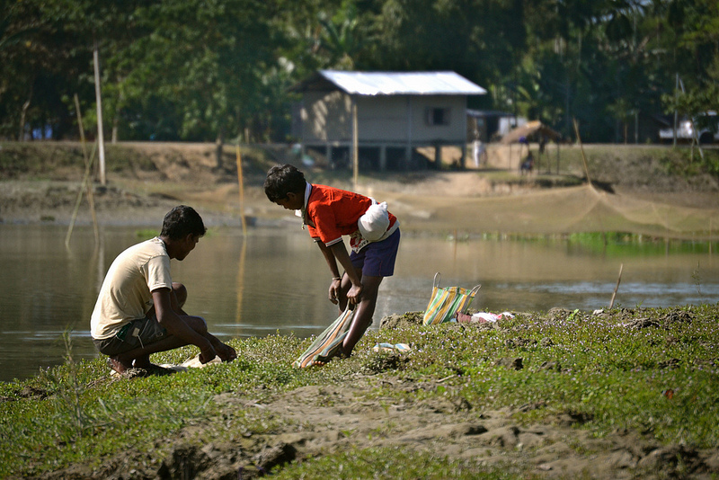 A father son duo sorting out their fish catch