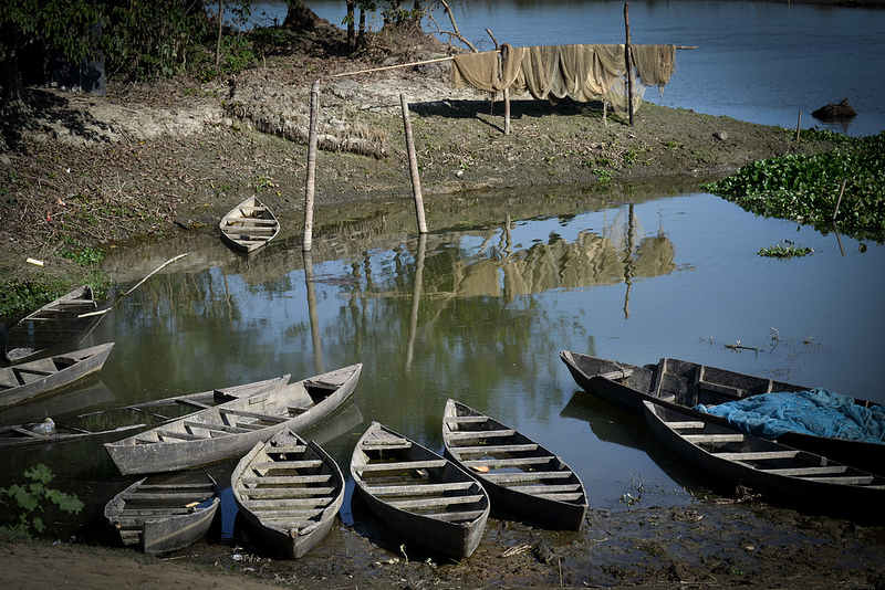 Country boats halting at the bank of the beel to take passengers