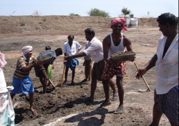 Villagers working on the tank 