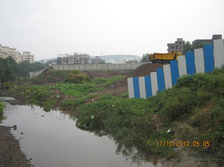 An apartment complex 'Pebbels' dumping mud right into the river channel