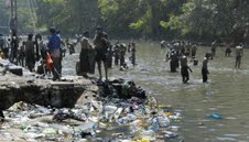 Pilgrims bathing in the polluted Pampa 