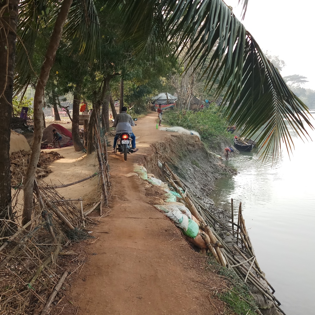 Sandbags are kept on the banks to stop further erosion while two wheelers have a tough time negotiating the narrow path. (Photo courtesy: Gurvinder Singh)