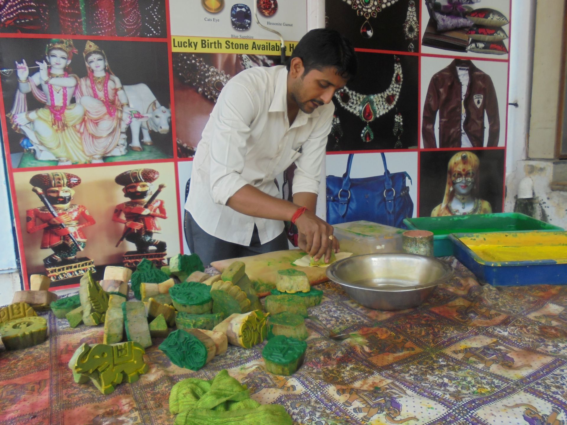 Wooden blocks being used to provide shapes and designs for conventional hand block printing 