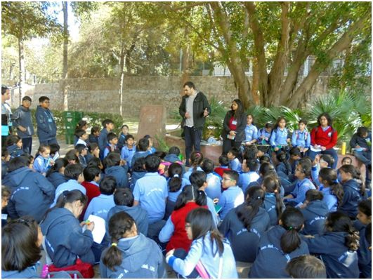 Nanda interacts with school children who are being trained in making floating wetlands at Hauz Khas lake. 