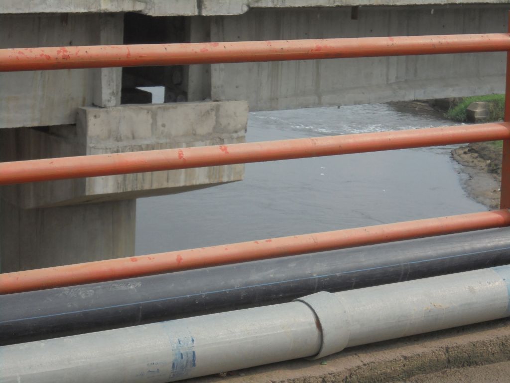 River Hindon from the Hindon bridge. Reduced to a constricted trickle, the river divides Noida and Greater Noida West.