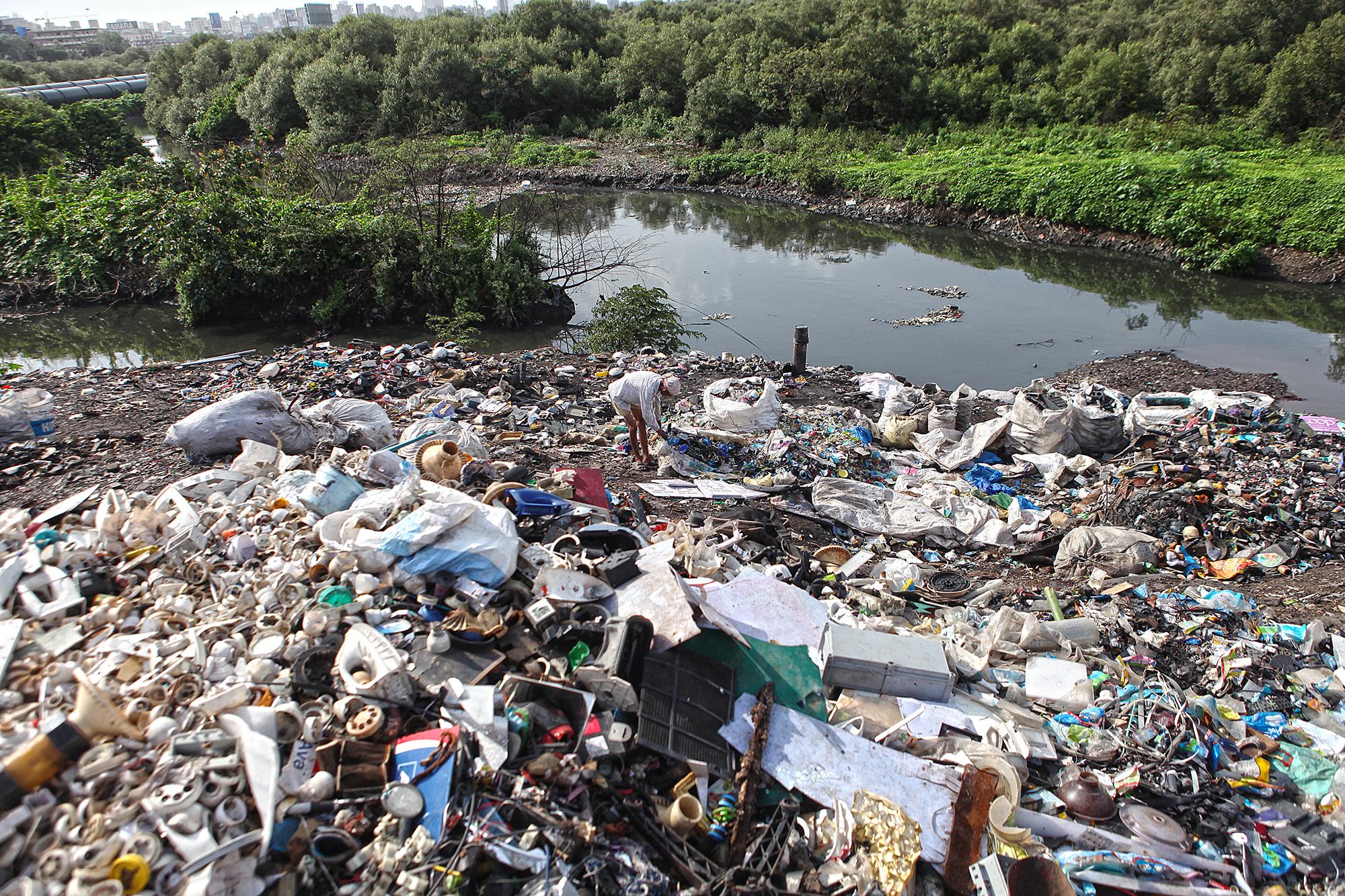 Waste lying on the banks of Mithi river waiting to be burnt or sold to recyclers