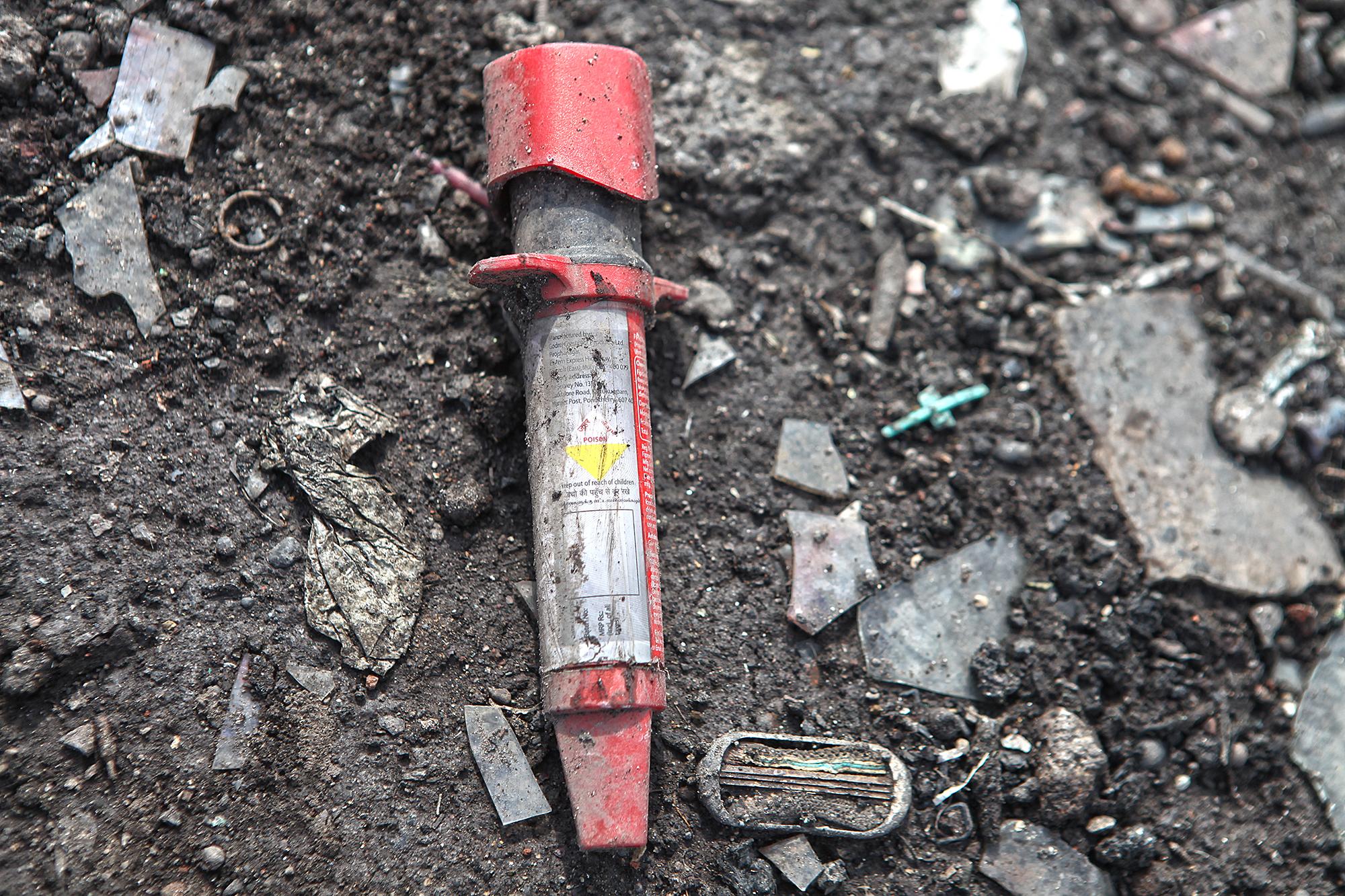 A rat poison tube washed to the shore of Mithi river near Mahim