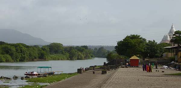 River bank with a temple in the background