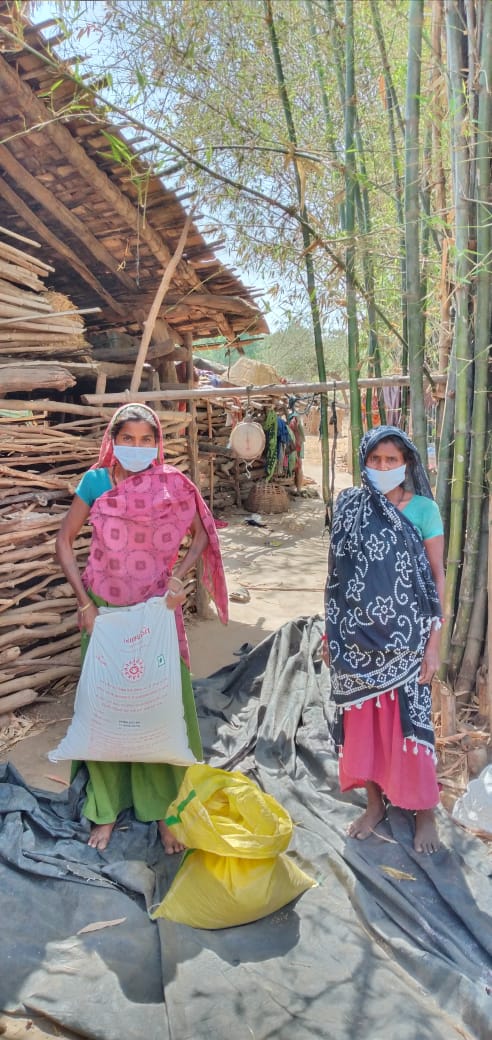 Women distributing relief material and essentials among communities that are vulnerable (Image: Utthan)