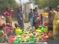 Women fill water from a public tap in Karnataka (Image source: IWP Flickr photos)