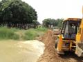 Earthmovers carrying out irrigation project works