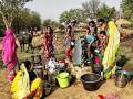 Women of Bagledi struggle to get a pot of drinking water from one of the four stand posts.(Pics: India Water Portal)