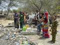 Women pump contaminated water from the hand pump at Bajankheda. (Source: India Water Portal)