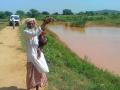 A villager shows the rainwater harvesting structure in Aravalli hills.