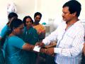 A Muruganantham shows the working of a sanitary pad to women. (Source: The Pad Piper)