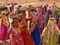 Women working on an NREGA site building a pond to assist in farming and water storage. Gopalpura, Jhabua, Madhya Pradesh (Image: UN Women/Gaganjit Singh, Flickr Commons)