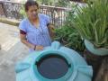 A resident in Delhi with her extracted groundwater (Source: IWP FLickr photos)