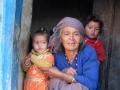 A woman with her grandchildren in her Munsyari home.