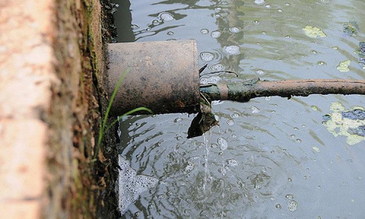 Wastewater gets discharged into a drain. (Source: IWP Flickr photos)