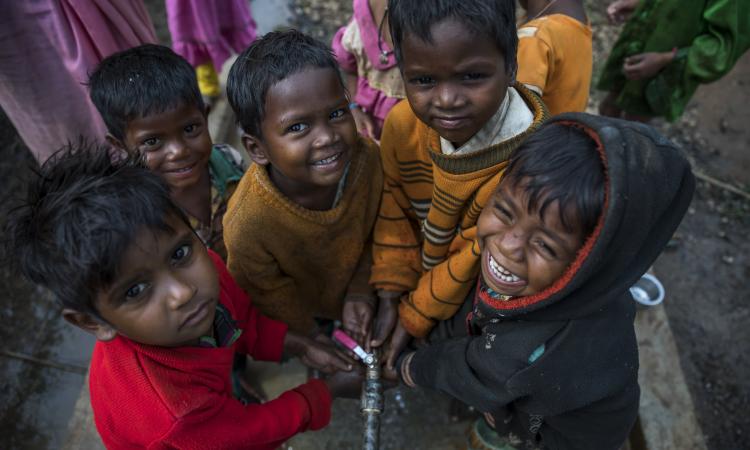 Children wash hands at a stand post installed in a Primary school at Kapoti Village in Karanjiya, Dhindori, Madhya Pradesh, India (Source: WaterAid India)