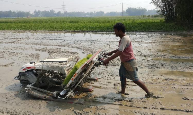 Gulam Mustafa with the rice planter. (Photo by Gurvinder Singh)