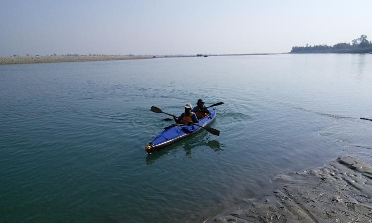 Theo and Zanskar set off on their canoe