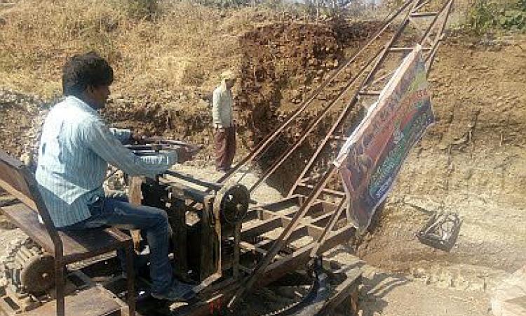 Digging an open well that had some water at lesser depths ranging from 5-10 m using local technology in which a motor run winch draws up the dug up mud from the well bottom. (Image: Rahul Banerjee)